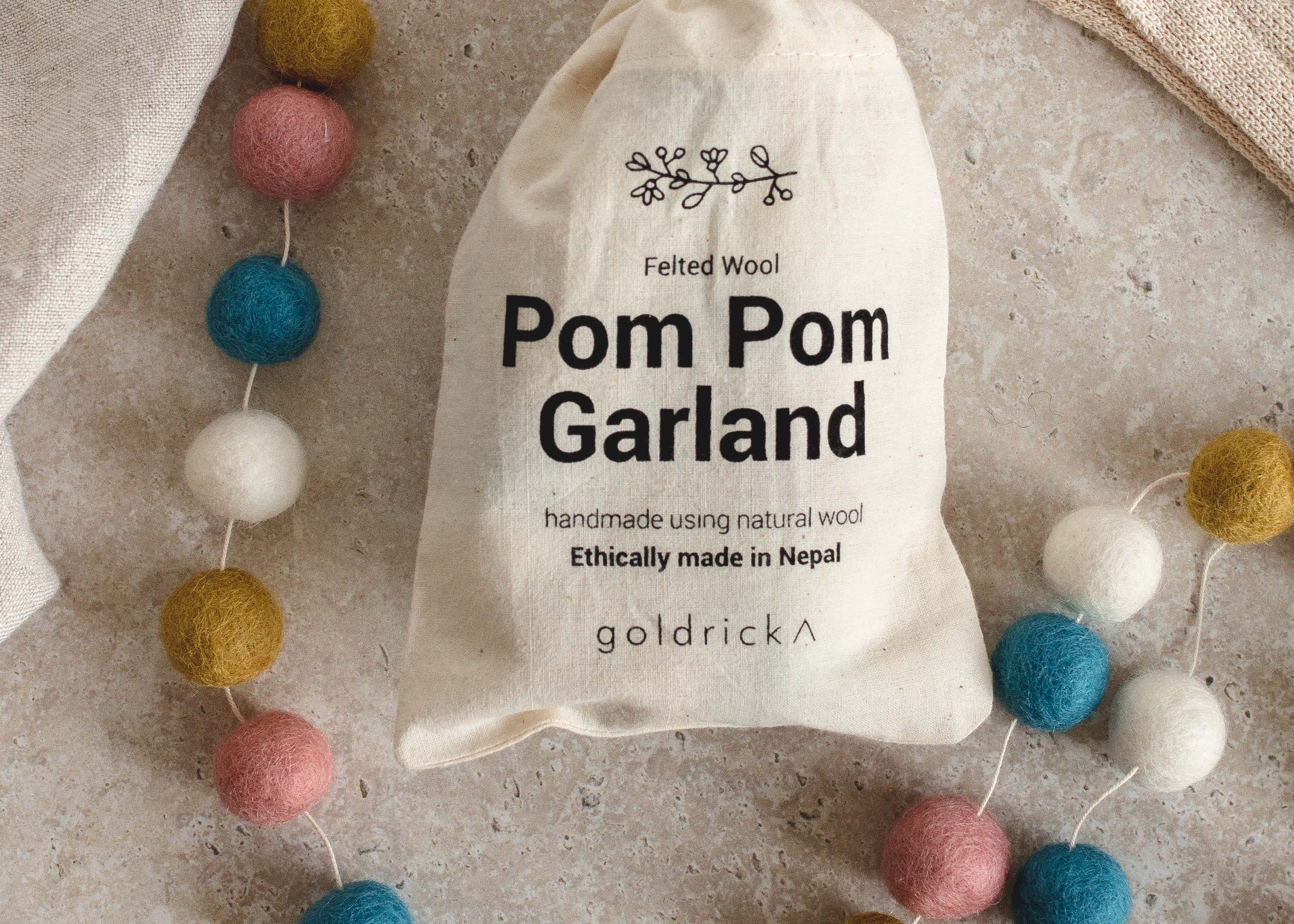 Pom Pom Garland | Natural Wool by Goldrick. Handmade Gifts, Gifting. Perfect for eco-conscious consumers.